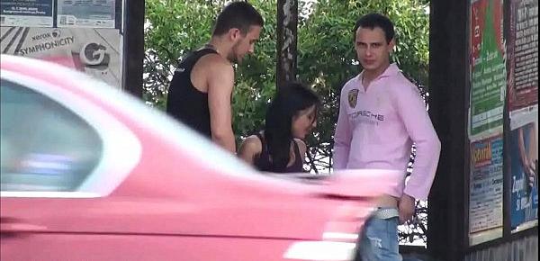  A big natural breasted brunette in public street bus stop threesome orgy gang bang with 2 hung guys with big dicks fucking her with a blowjob and vaginal pussy sex action in front of all the car, bus, and truck drivers and people walking on the street